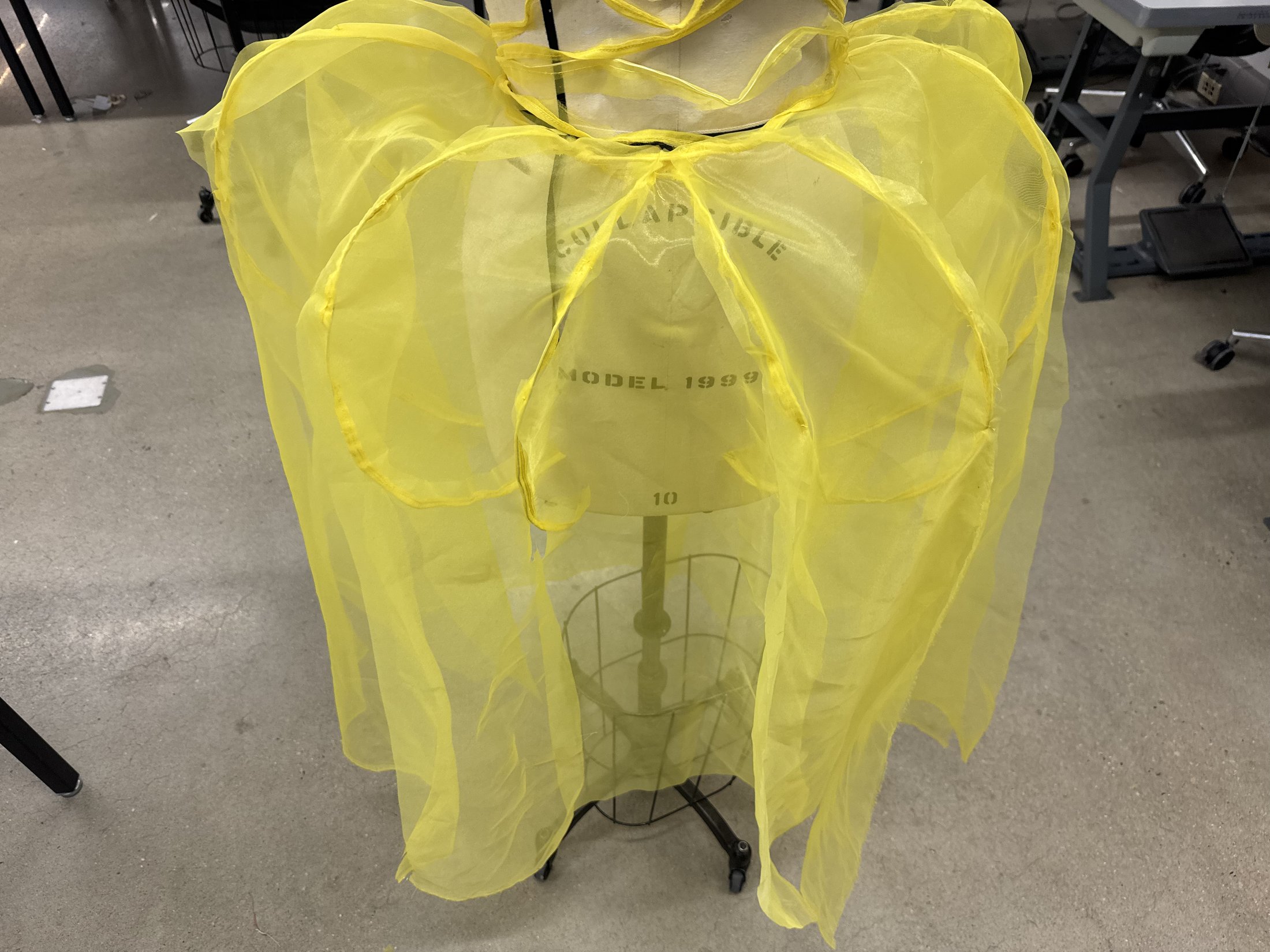 Close-up of the sheer yellow garment study