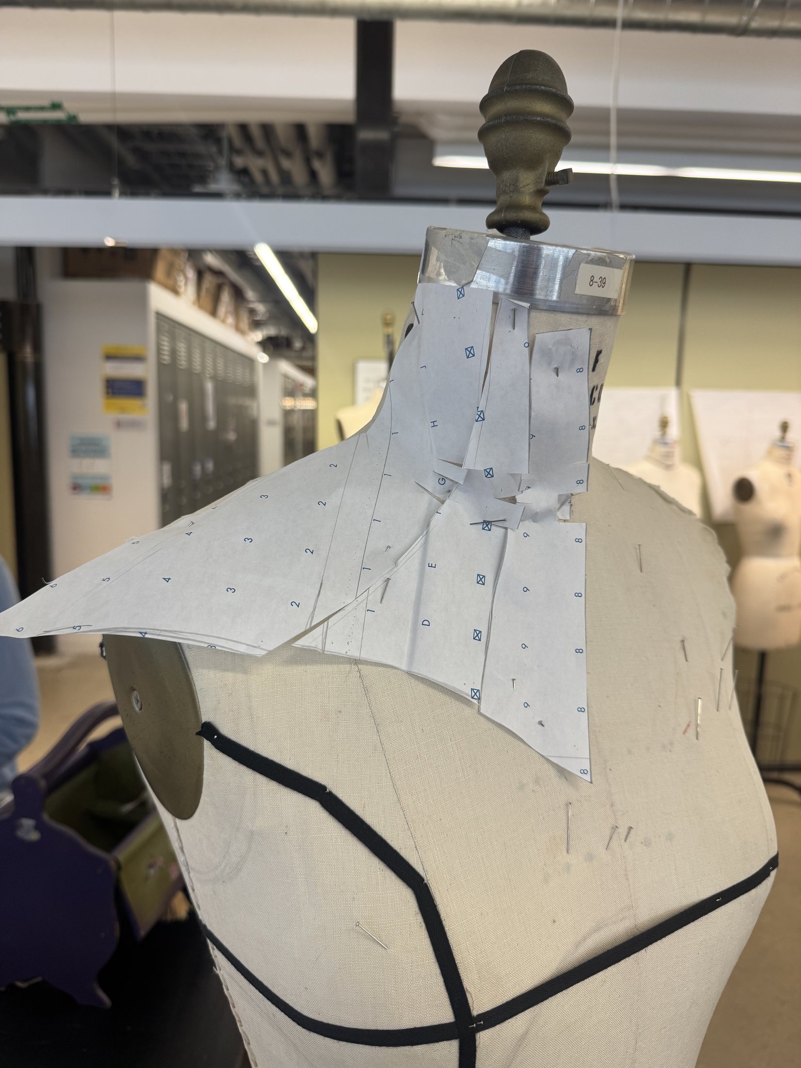 Paper shoulder form on a dress form