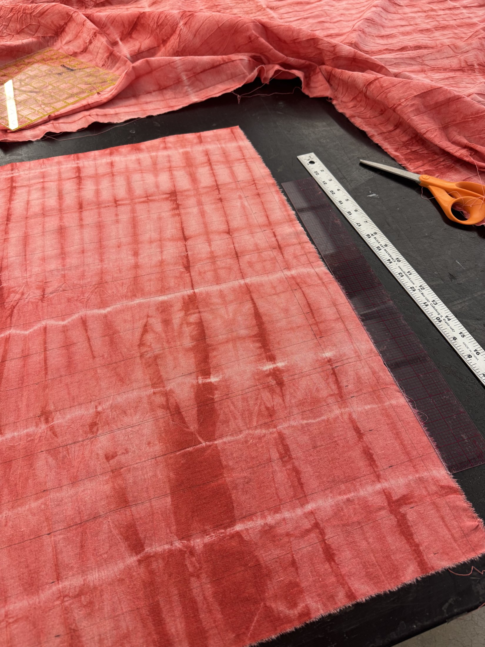Pink fabric marked for construction
