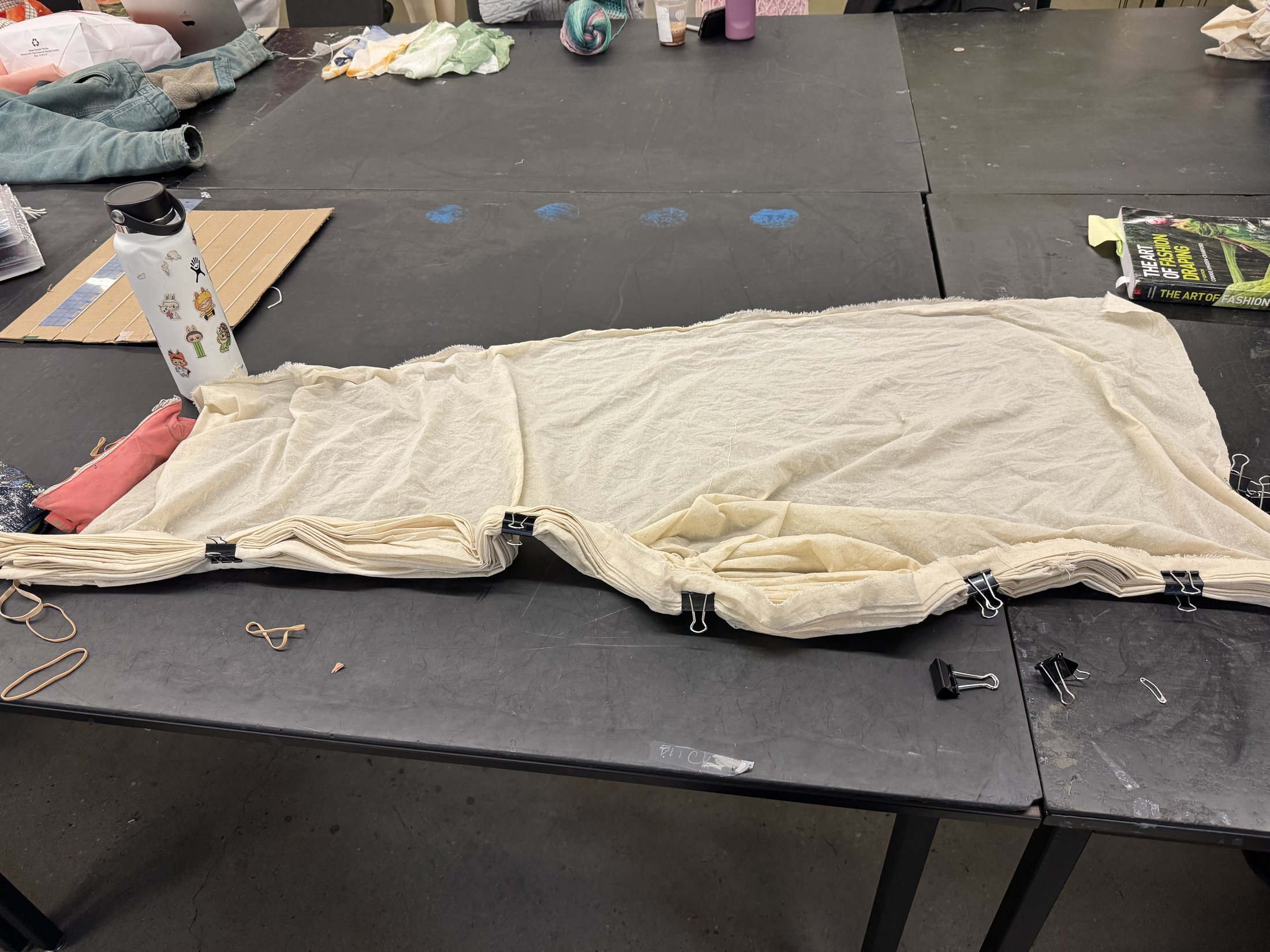 Light-colored fabric prepared on the work table